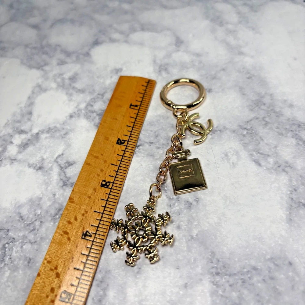 CHANEL Perfume Bottle CC Holiday Snow Flake Bag Charm Key Ring Chain Gold New